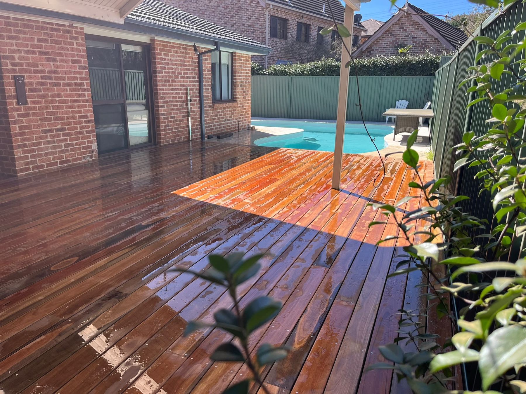Hardwood pool deck with timber pergola posts